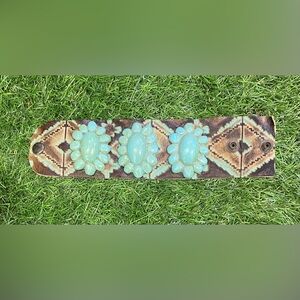 Beautiful handmade leather cuff bracelet featuring bold turquoise-style conchos